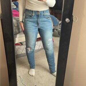 Universal Threads medium wash distressed straight leg jeans.